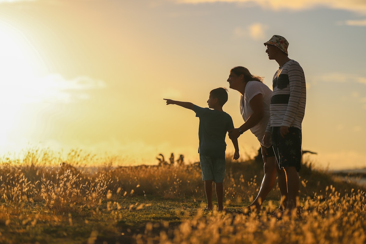 A family walks together at sunset — predictive algorithms now score families before a caseworker ever visits
