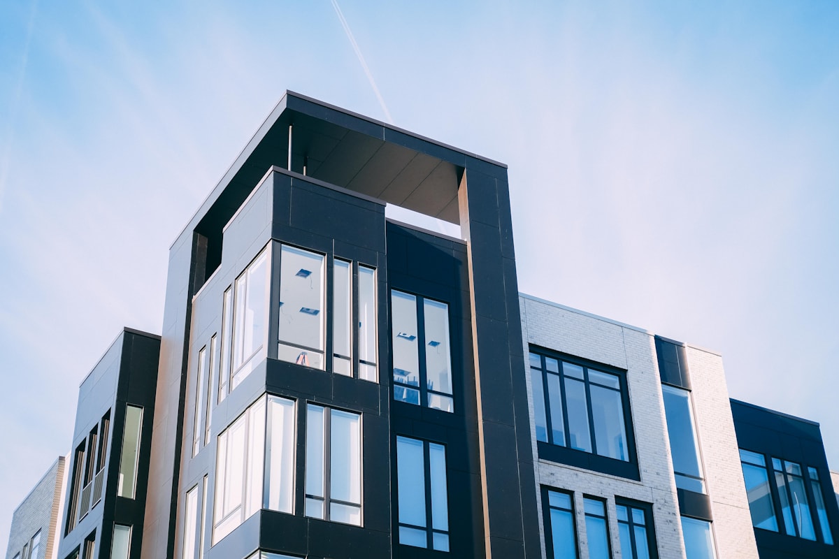 Concrete apartment building exterior — millions of Americans face eviction courts with no legal representation