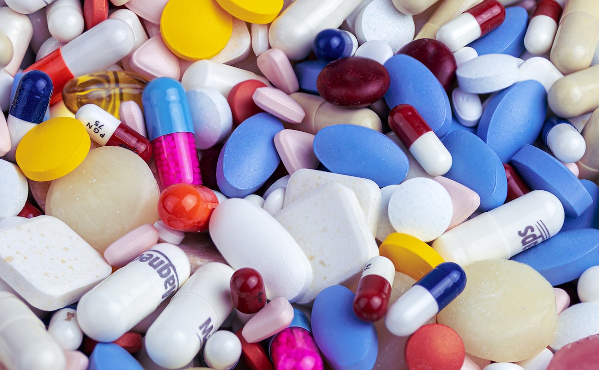 Prescription pills scattered loose — the opioid crisis killed more than 500,000 Americans over two decades