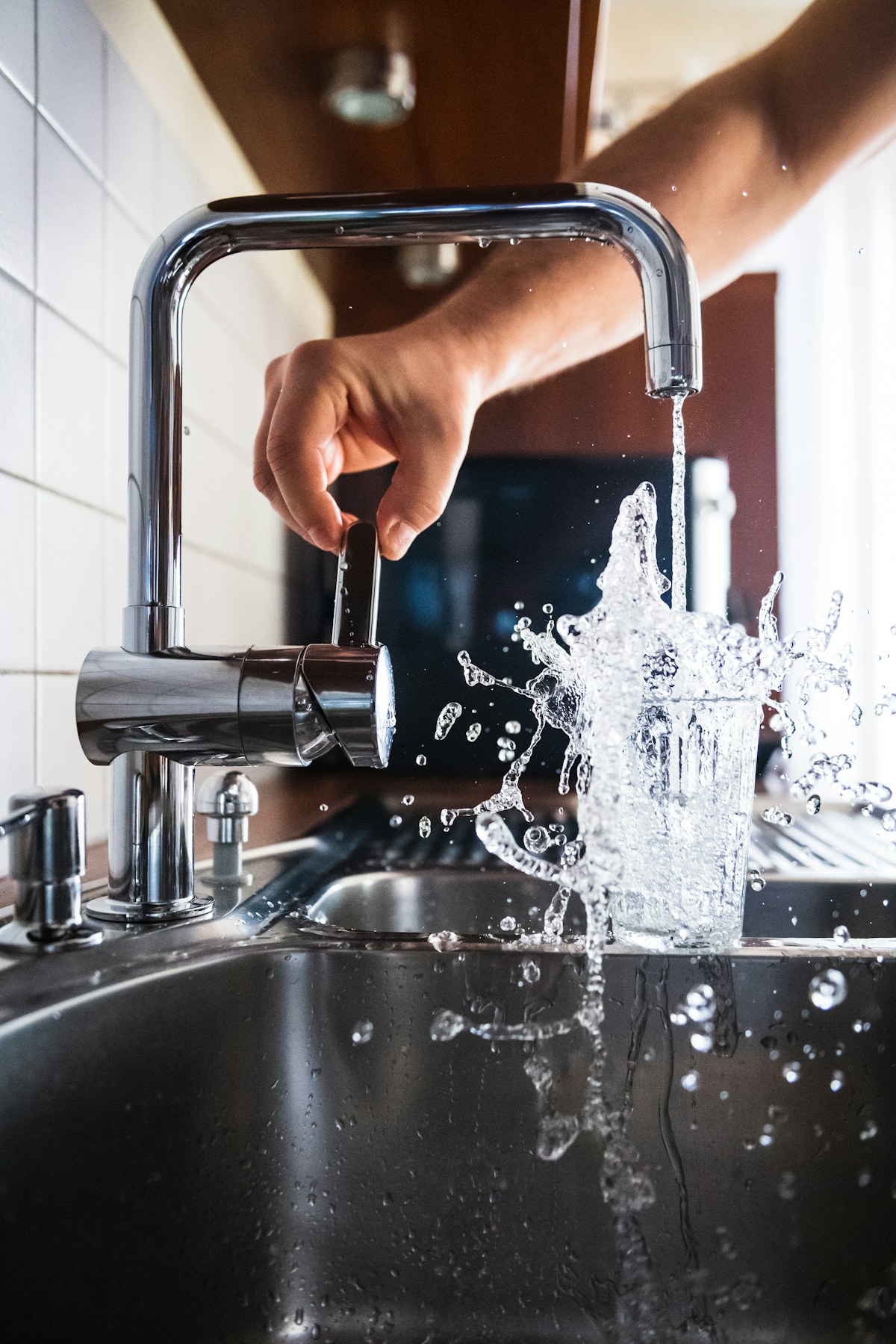 Water flowing from a residential faucet — PFAS contamination is detected in tap water across 45 percent of U.S. systems